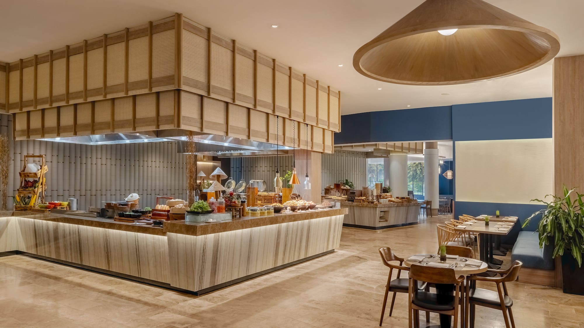 a restaurant with a buffet and a large chandelier