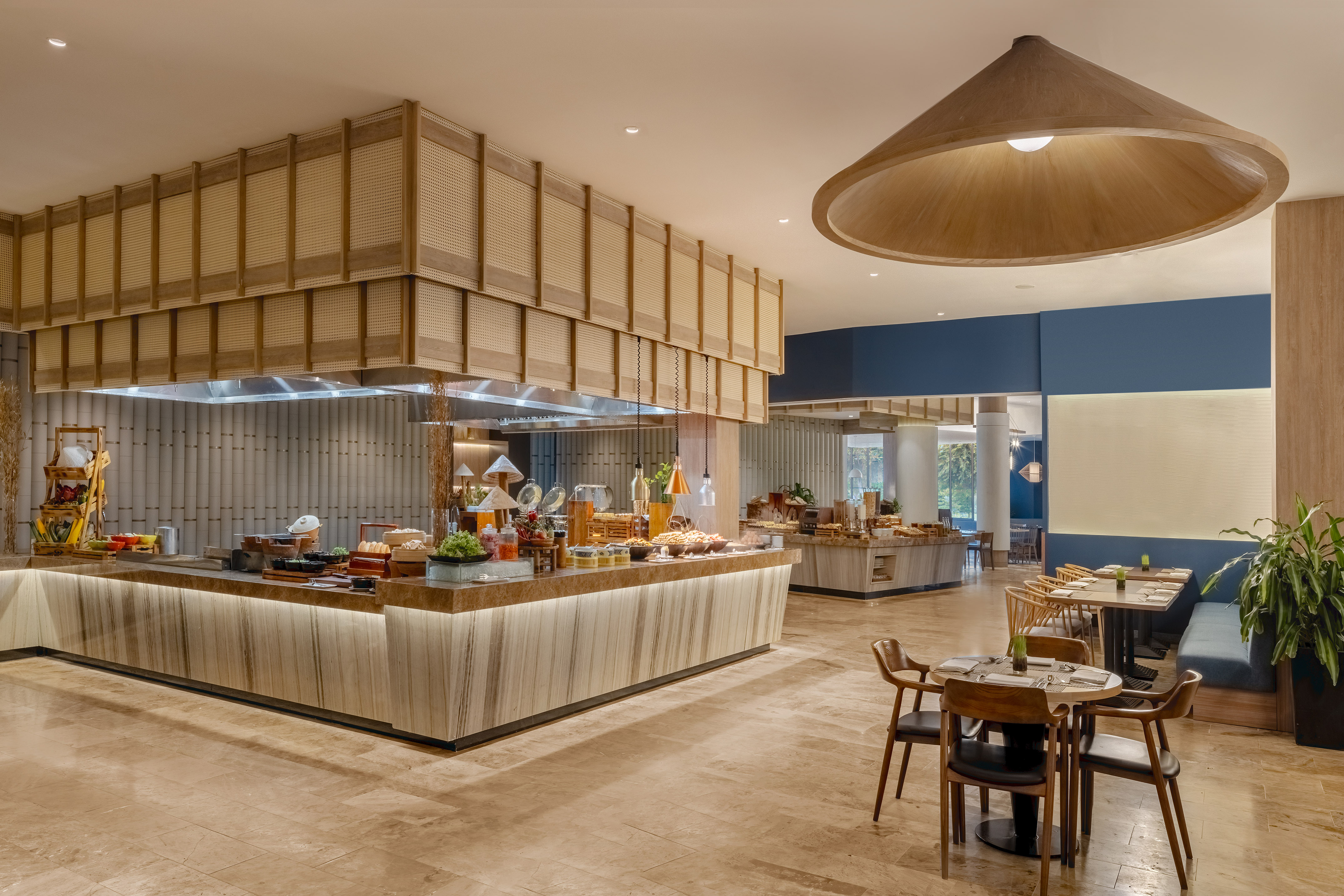 a restaurant with a buffet and a large chandelier