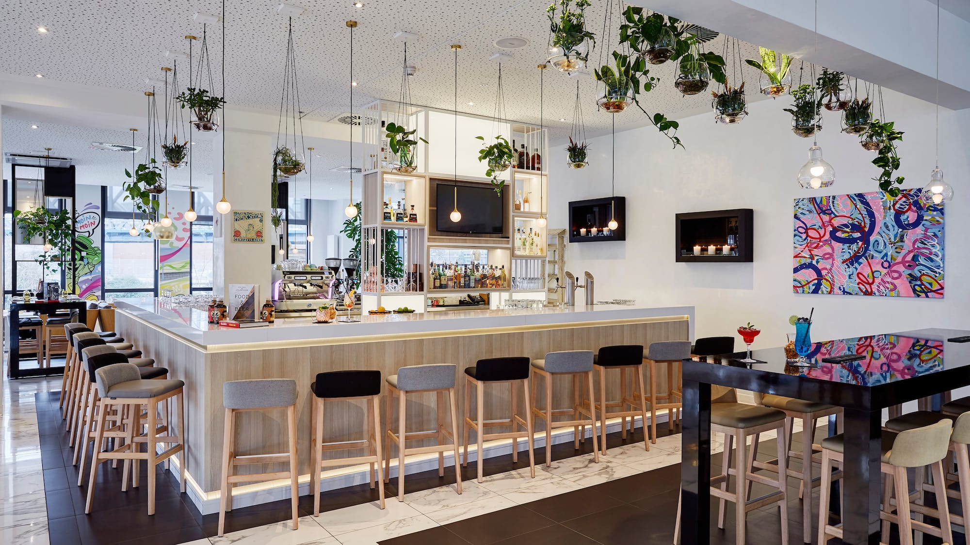 a bar with plants from the ceiling