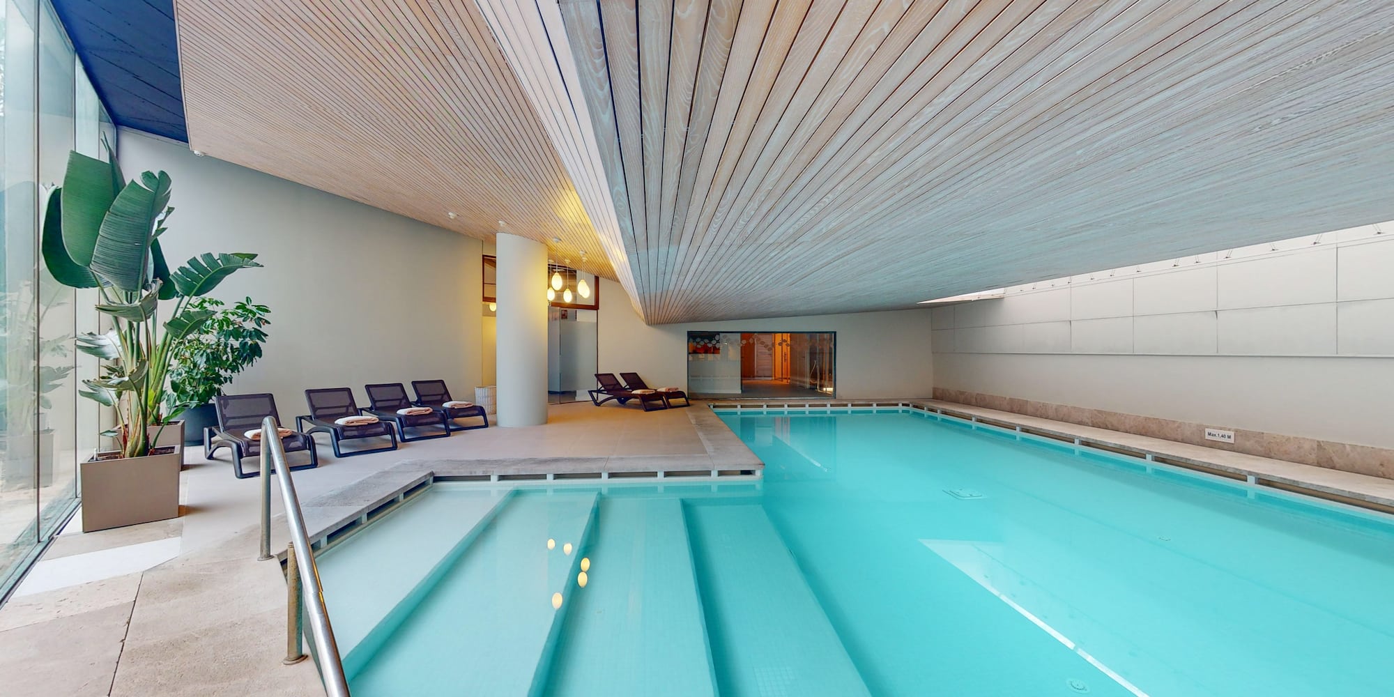 a pool with chairs around it