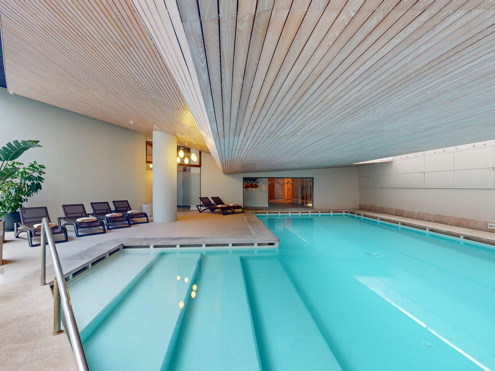 a pool with chairs around it