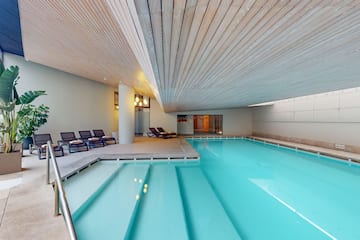 a pool with chairs around it