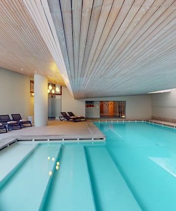 a pool with chairs around it