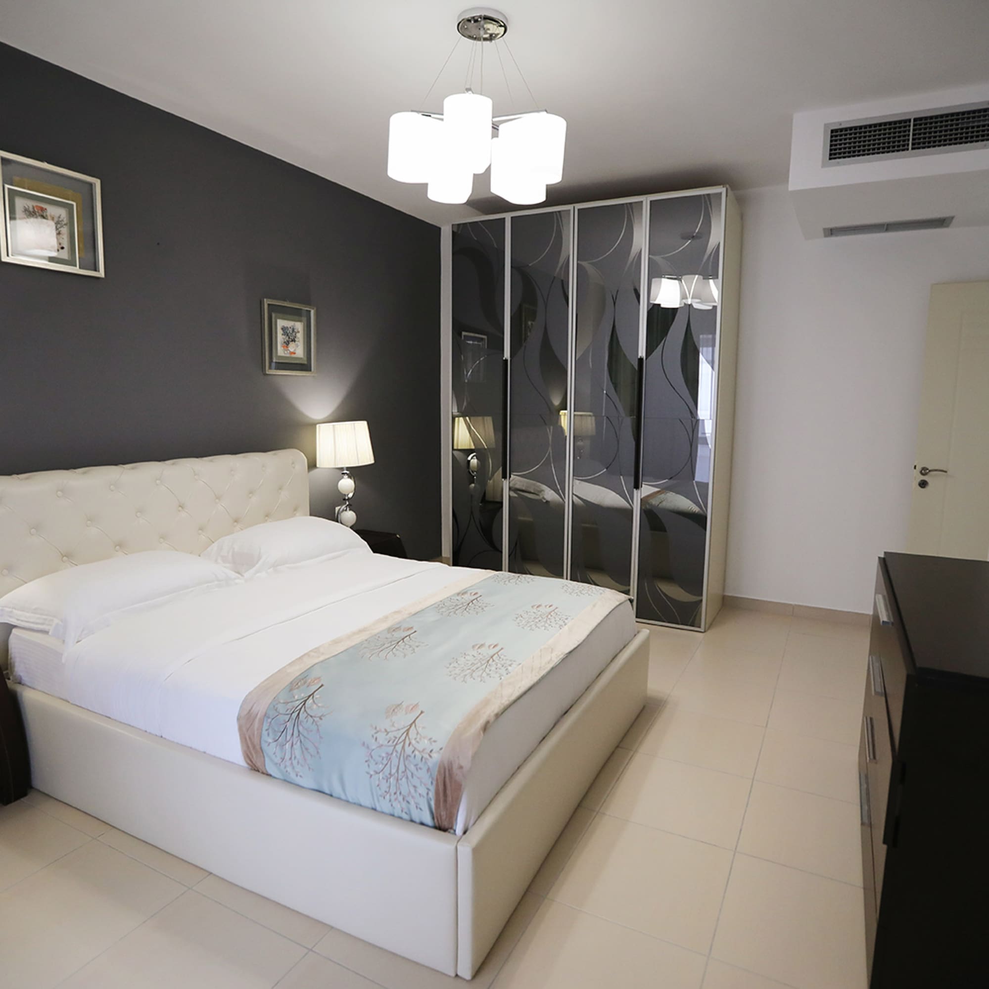 a bedroom with a bed and a closet