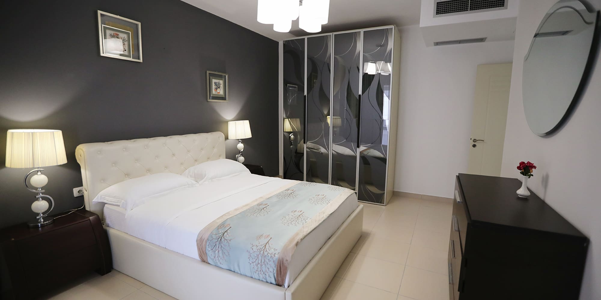 a bedroom with a bed and a closet