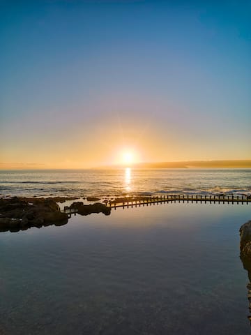 a body of water with a bridge over it