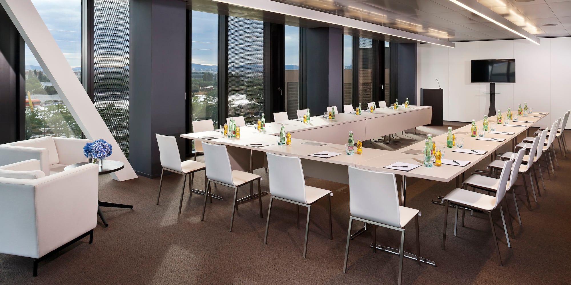 a room with a long table and chairs