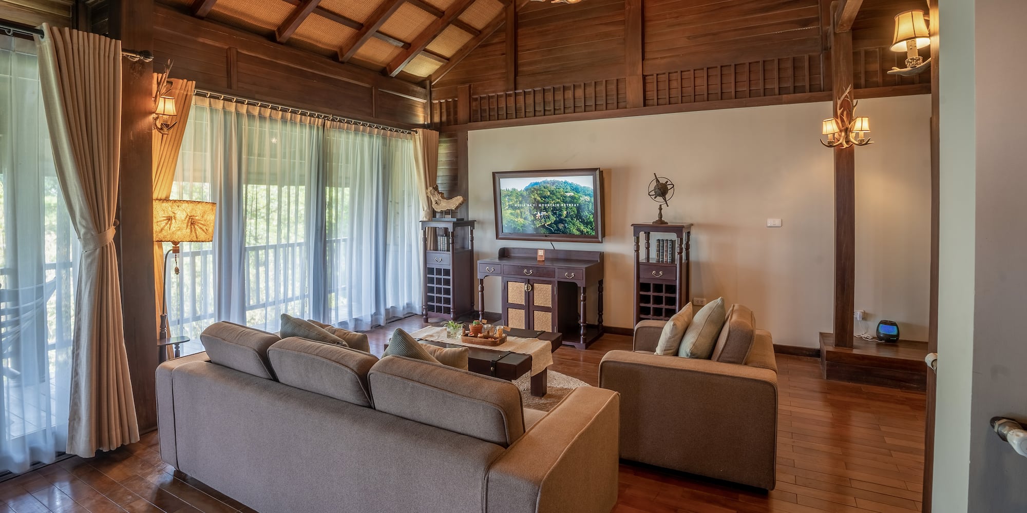 a living room with a television and couches