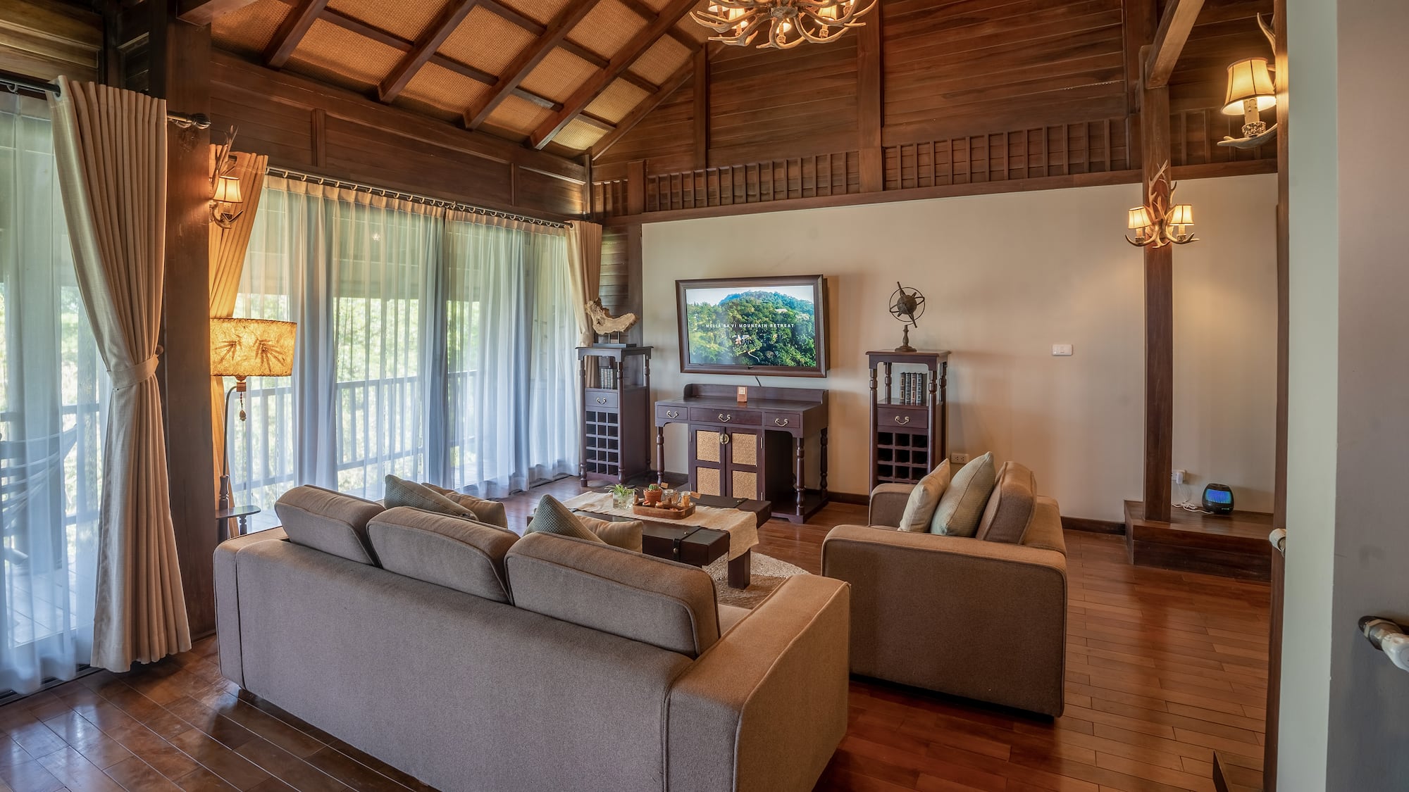 a living room with a television and couches