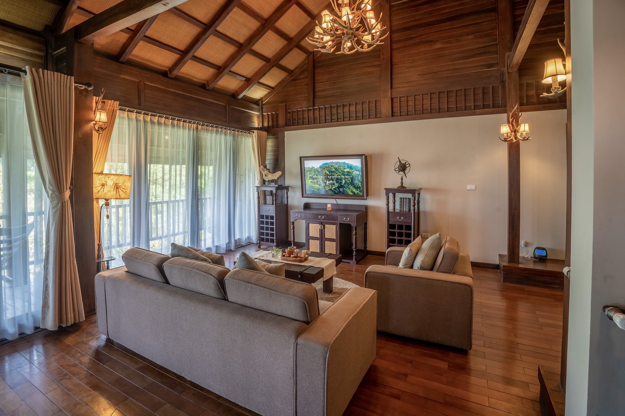 a living room with a television and couches