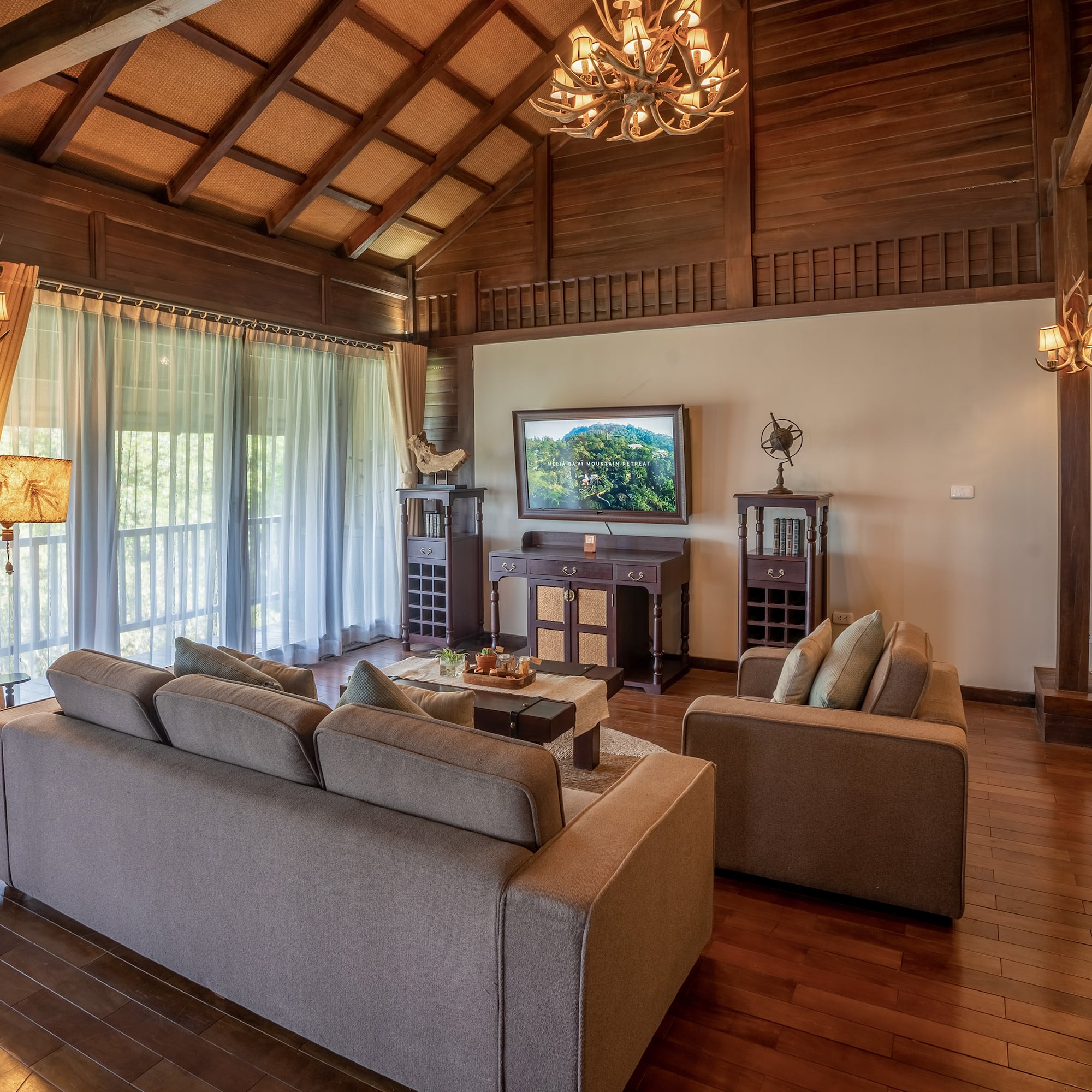 a living room with a television and couches