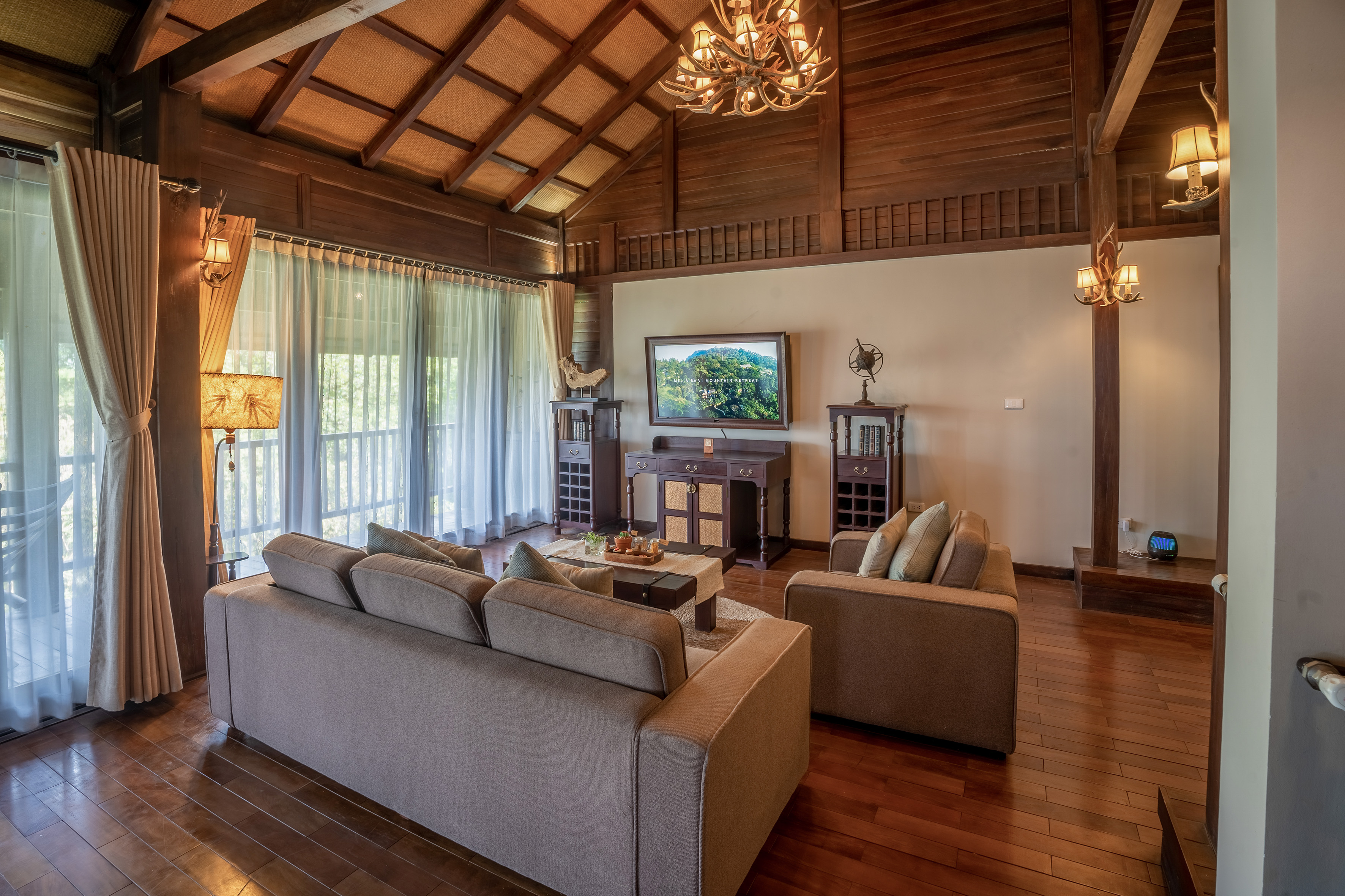 a living room with a television and couches