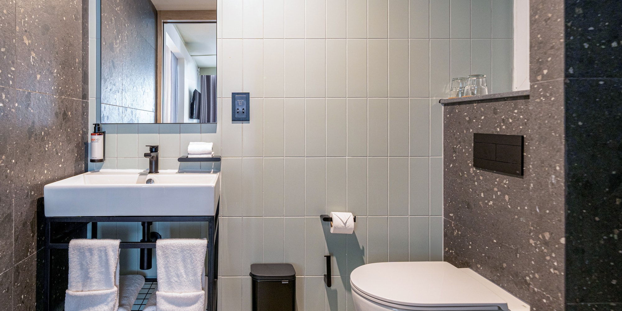 a bathroom with a sink and toilet