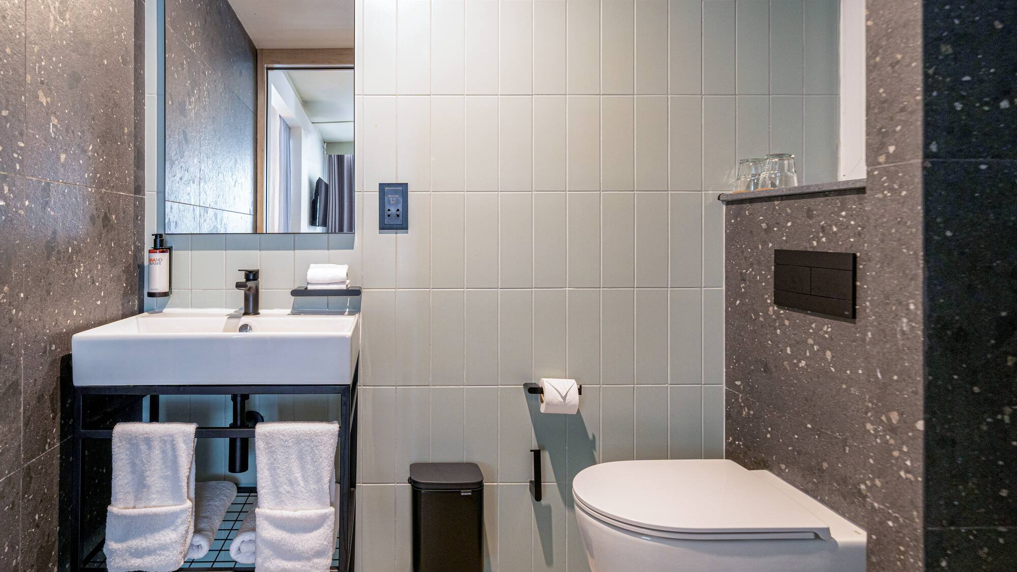 a bathroom with a sink and toilet