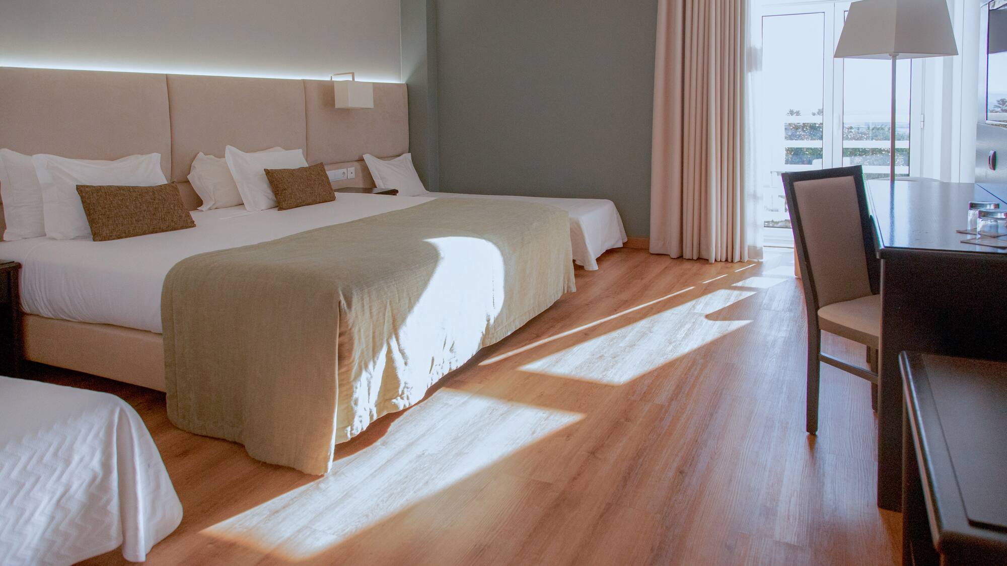 a room with a bed and a chair