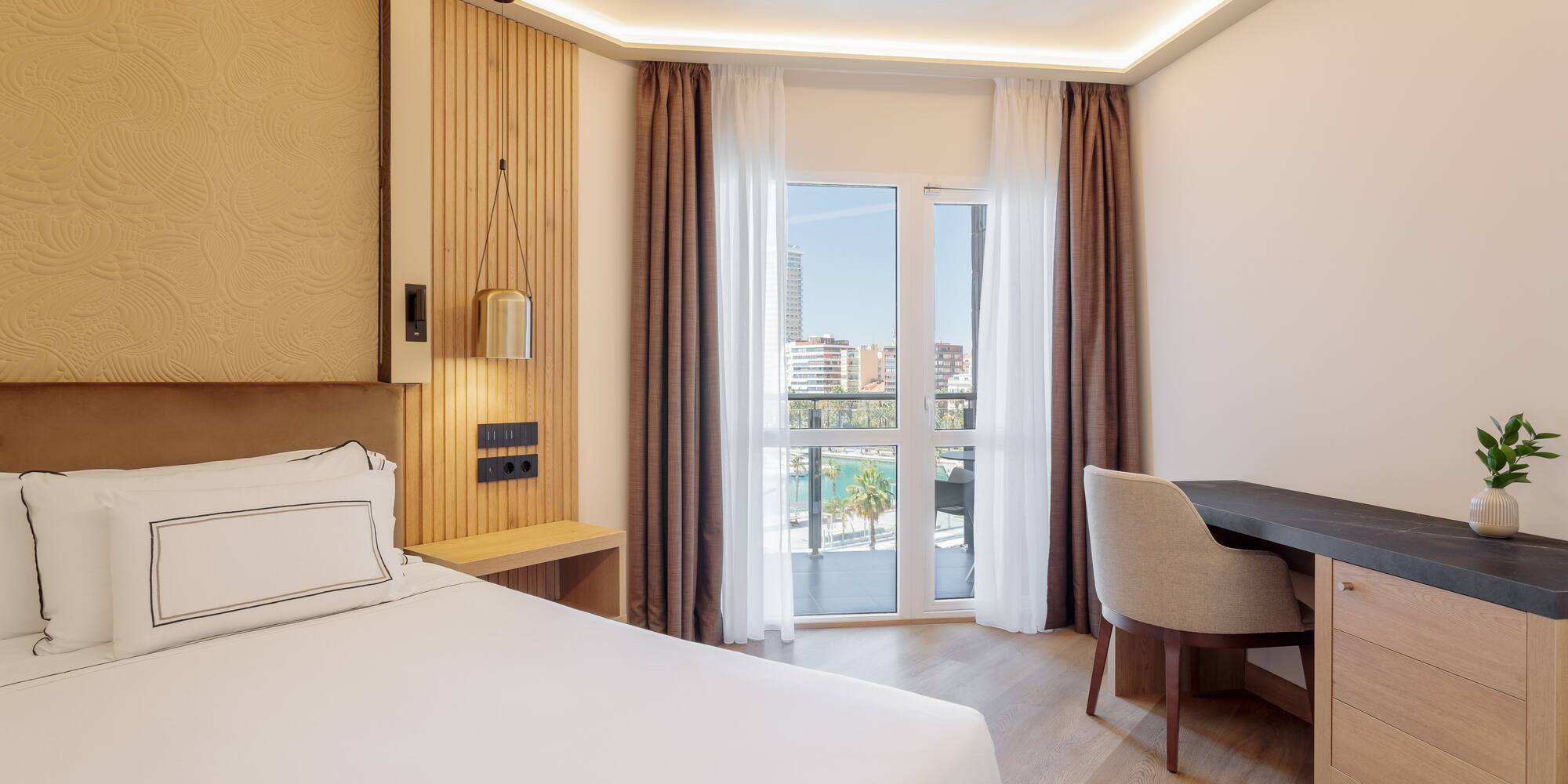 a room with a bed and desk