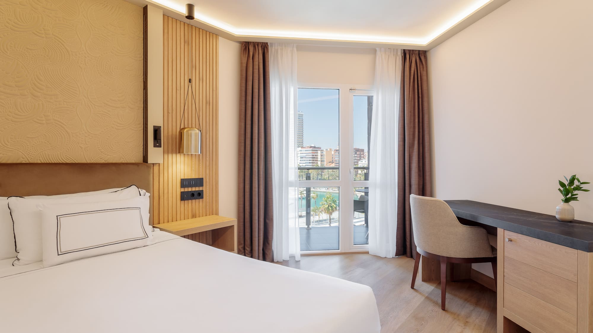 a room with a bed and desk