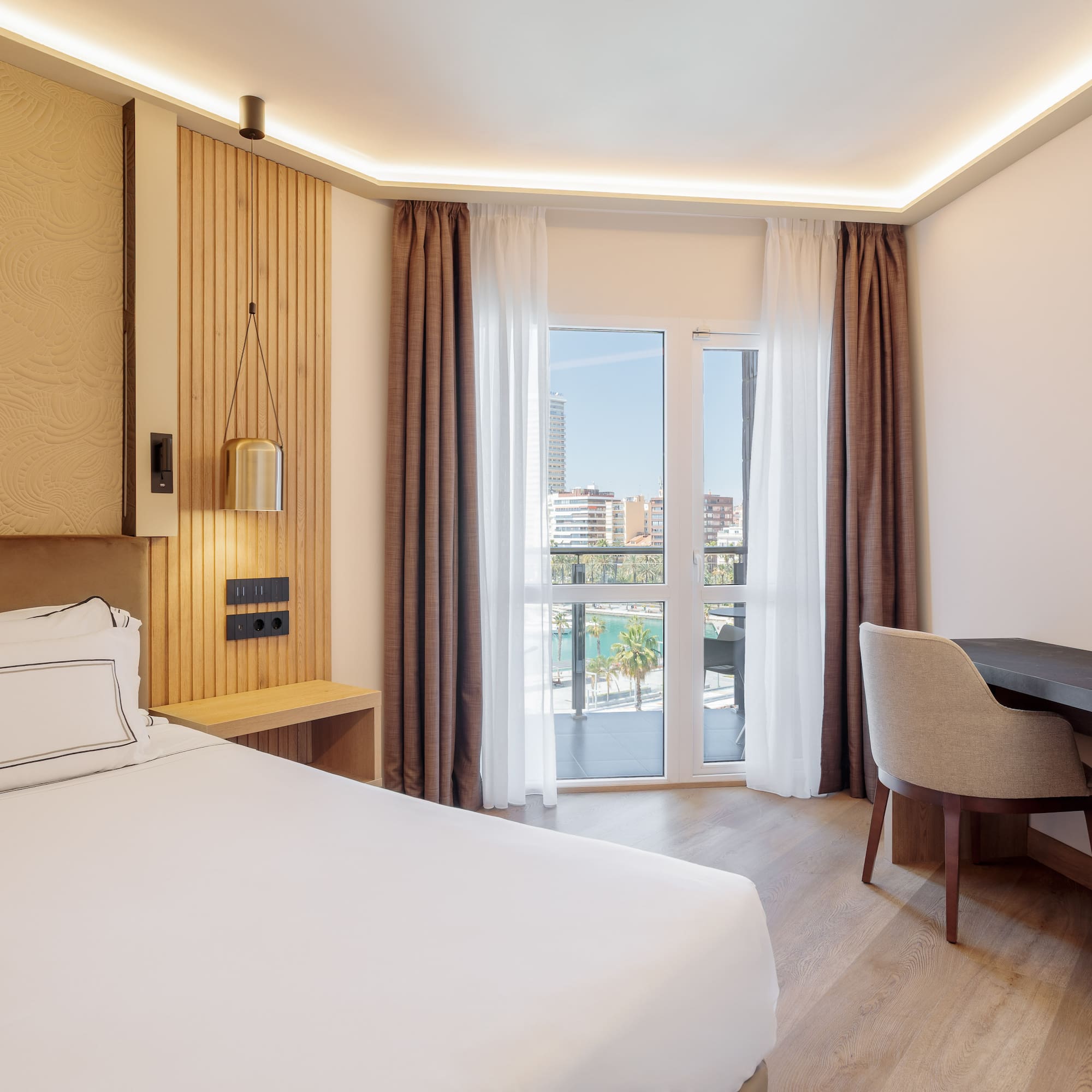 a room with a bed and desk