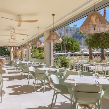 a restaurant with tables and chairs