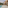 Luxury private pool patio with modern loungers, dining, and sunshade.