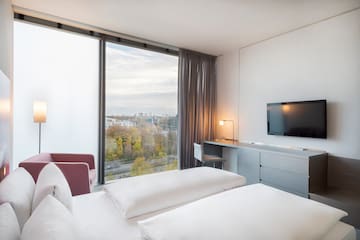 a room with a television and a window