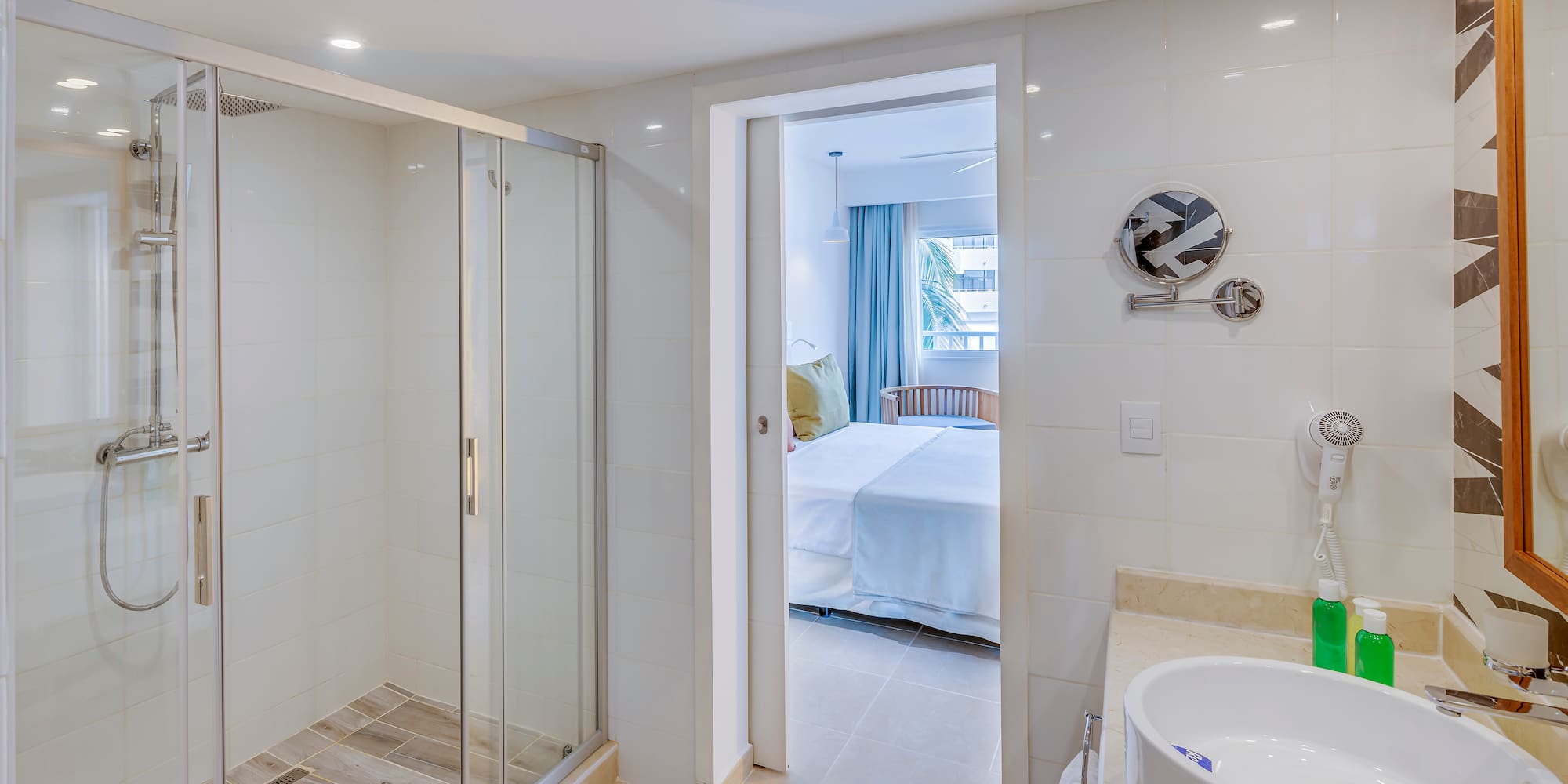 a bathroom with a shower and sink