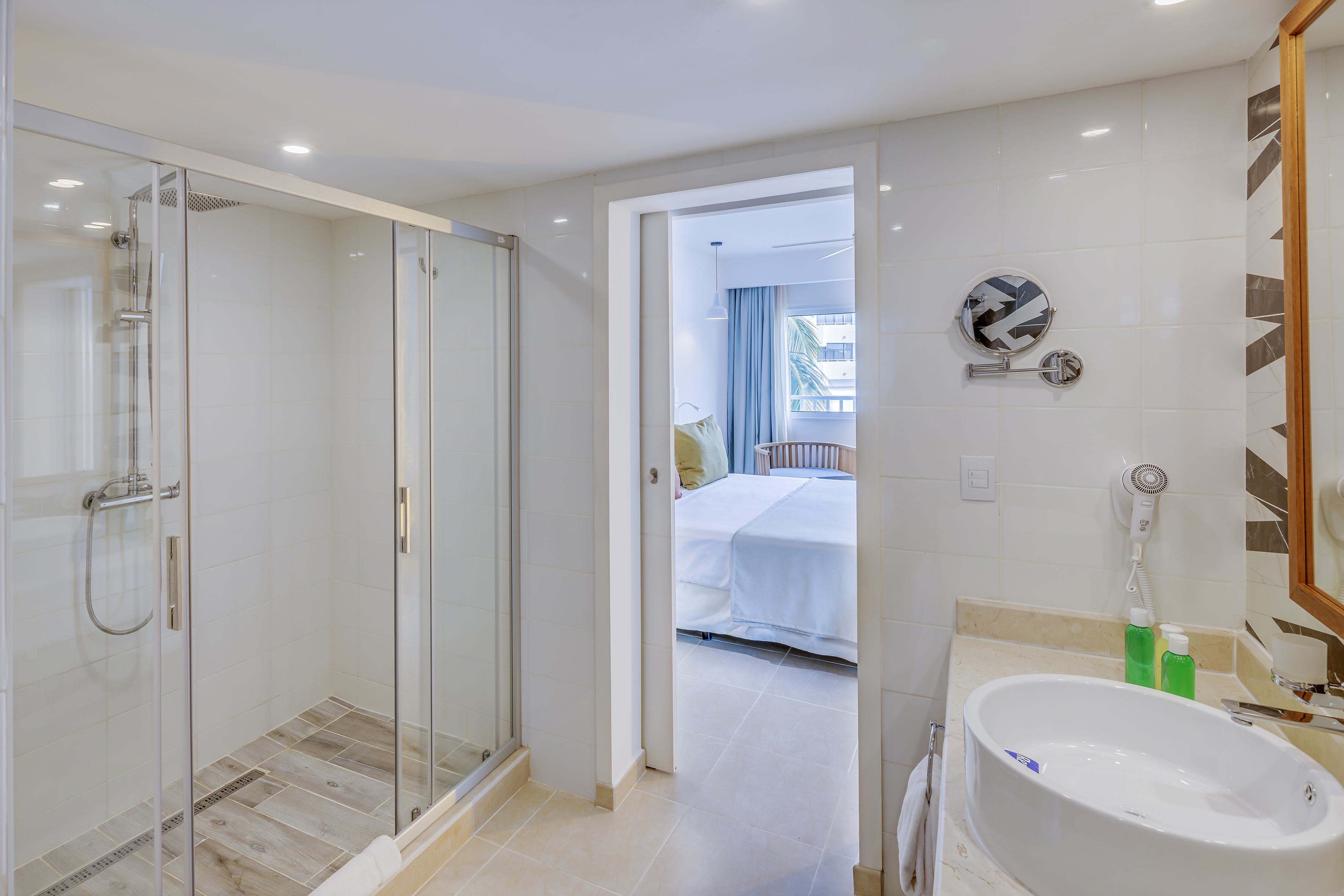 a bathroom with a shower and sink