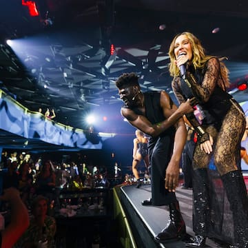 a man and woman on a stage with a microphone