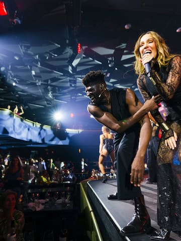a man and woman on a stage with a microphone