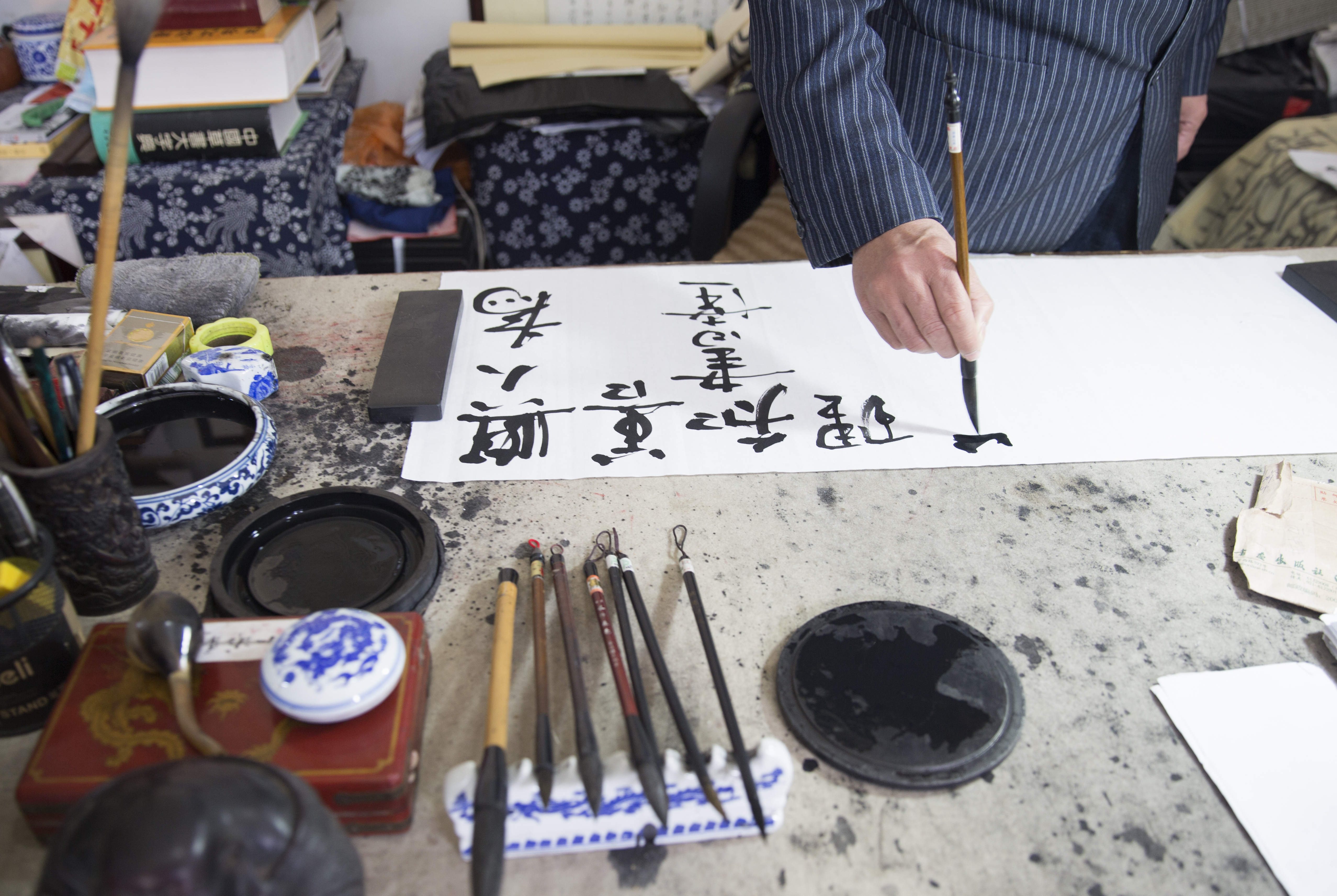 a person writing on a paper