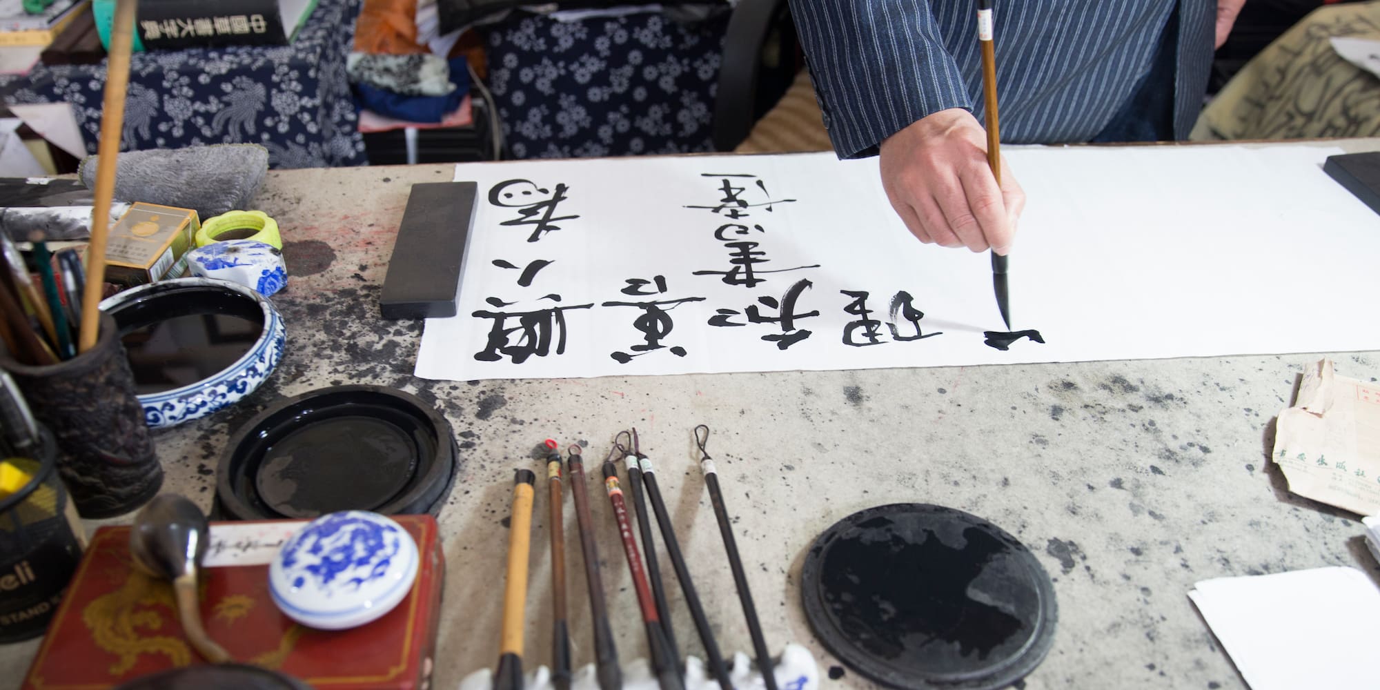 a person writing on a paper