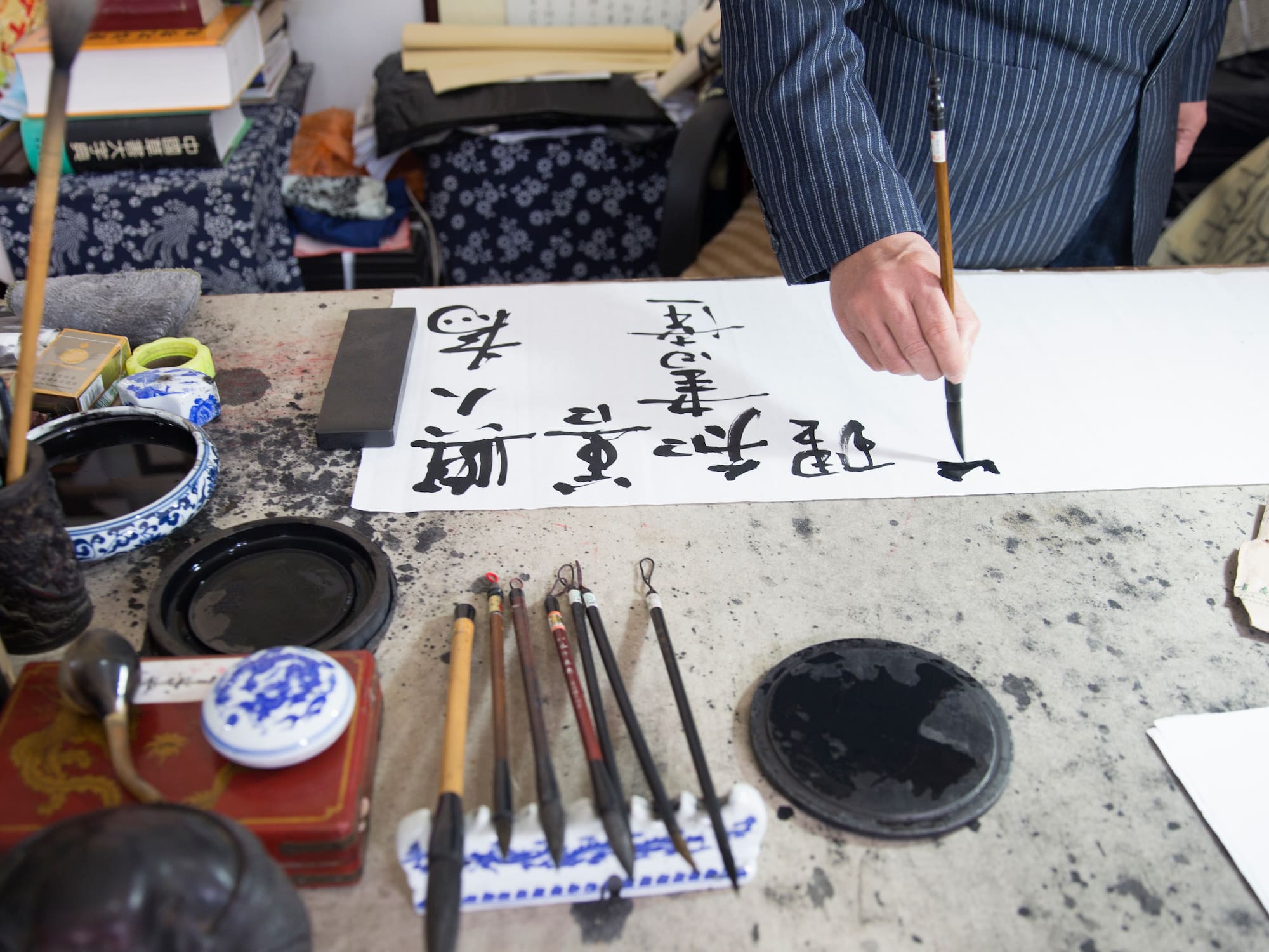 a person writing on a paper