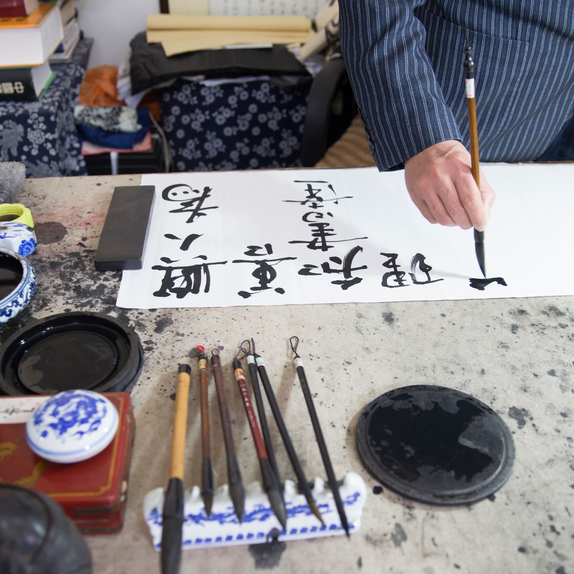 a person writing on a paper