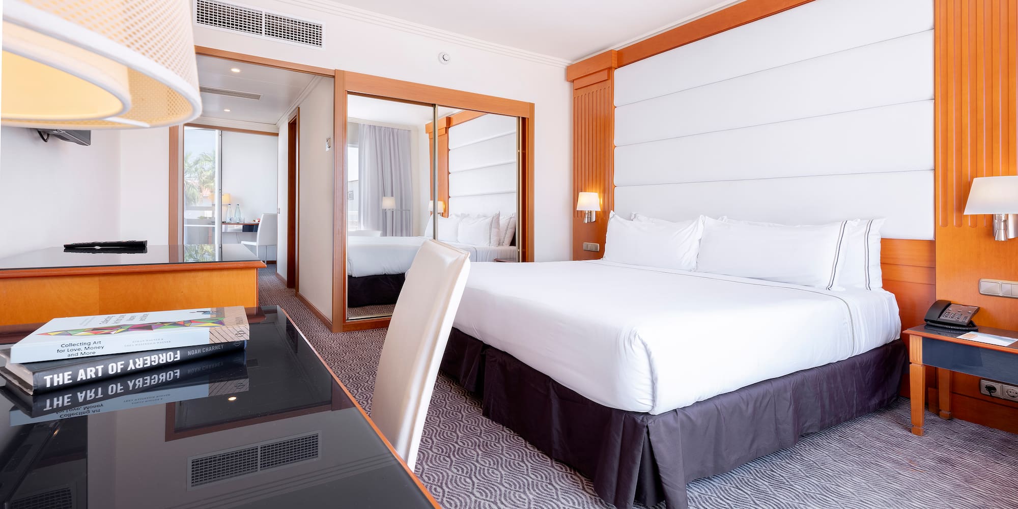 a room with a bed and a desk