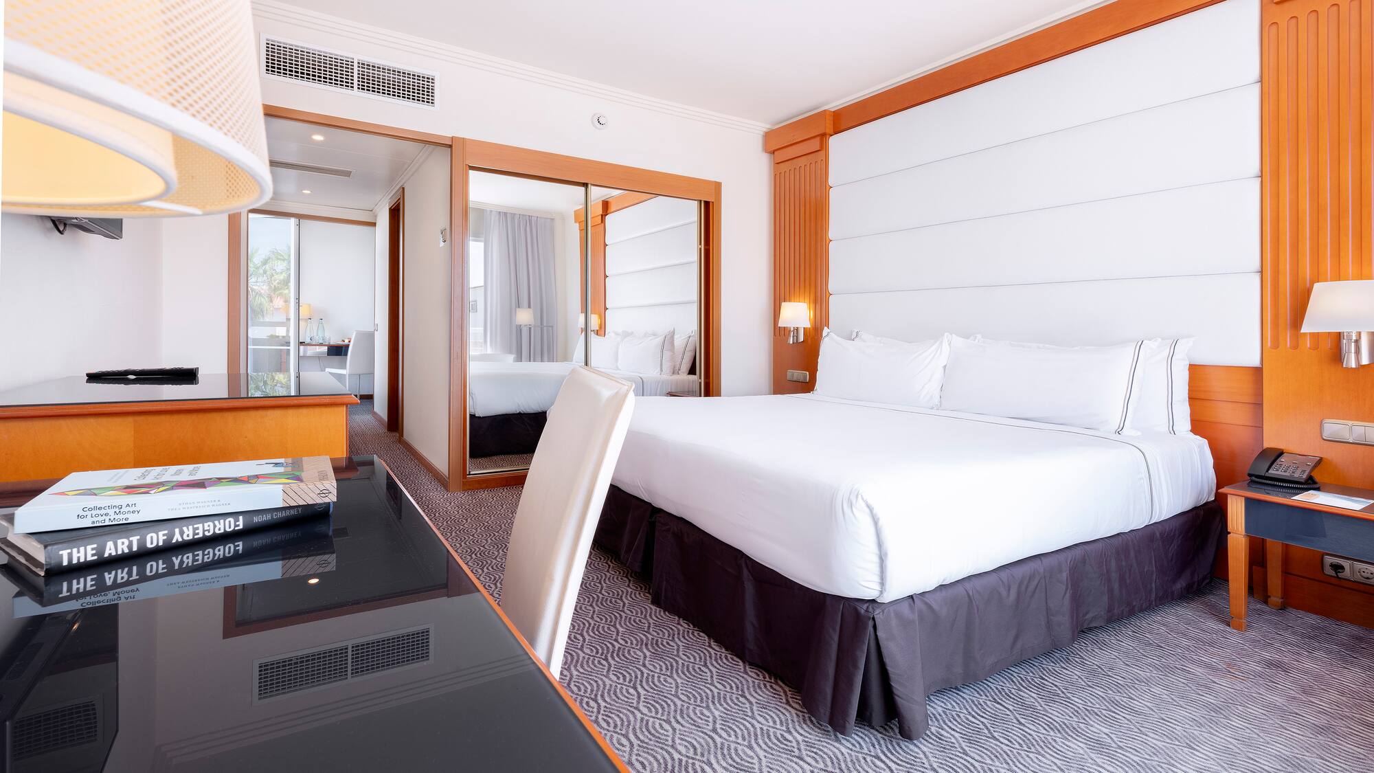 a room with a bed and a desk