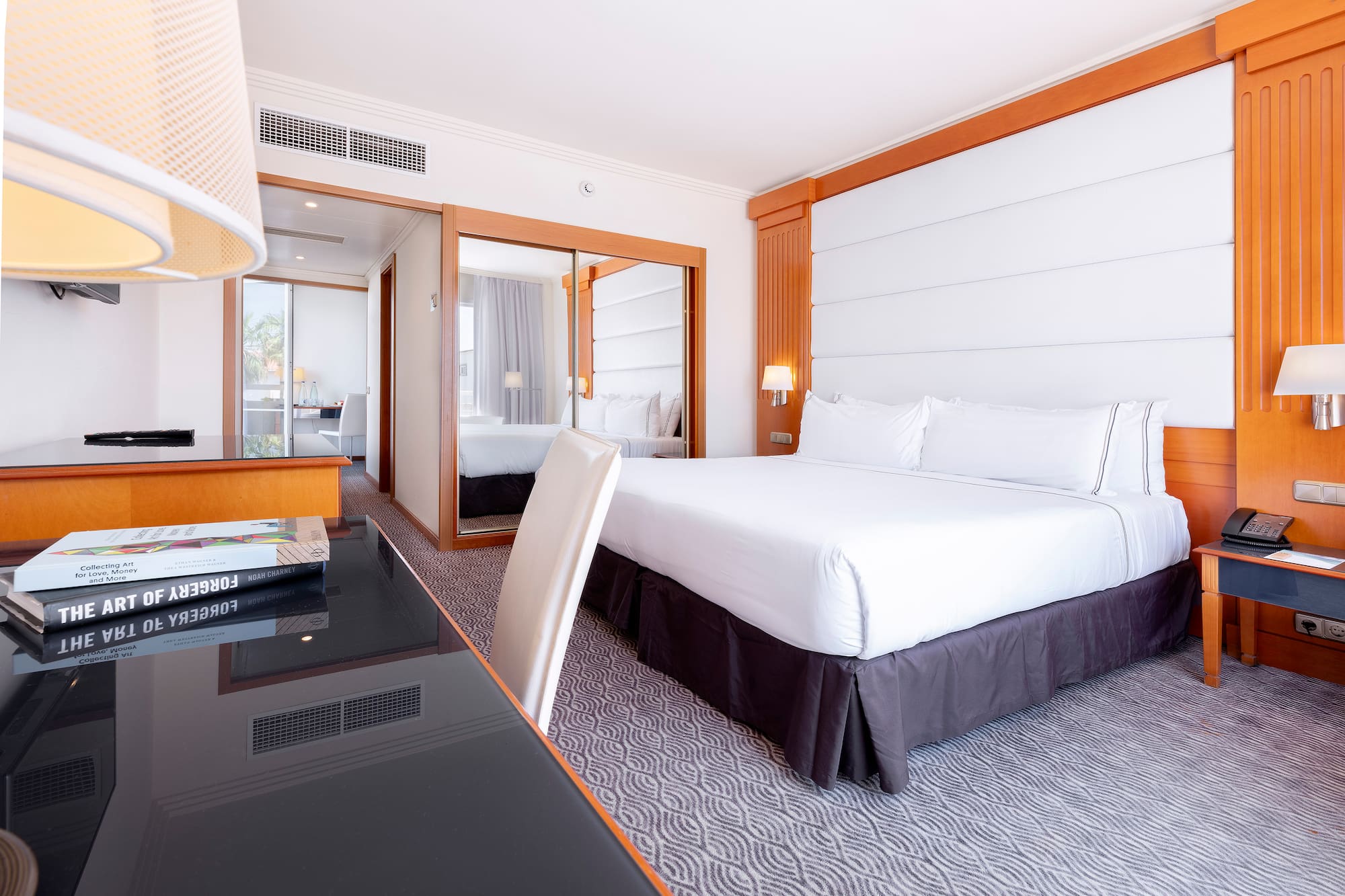 a room with a bed and a desk