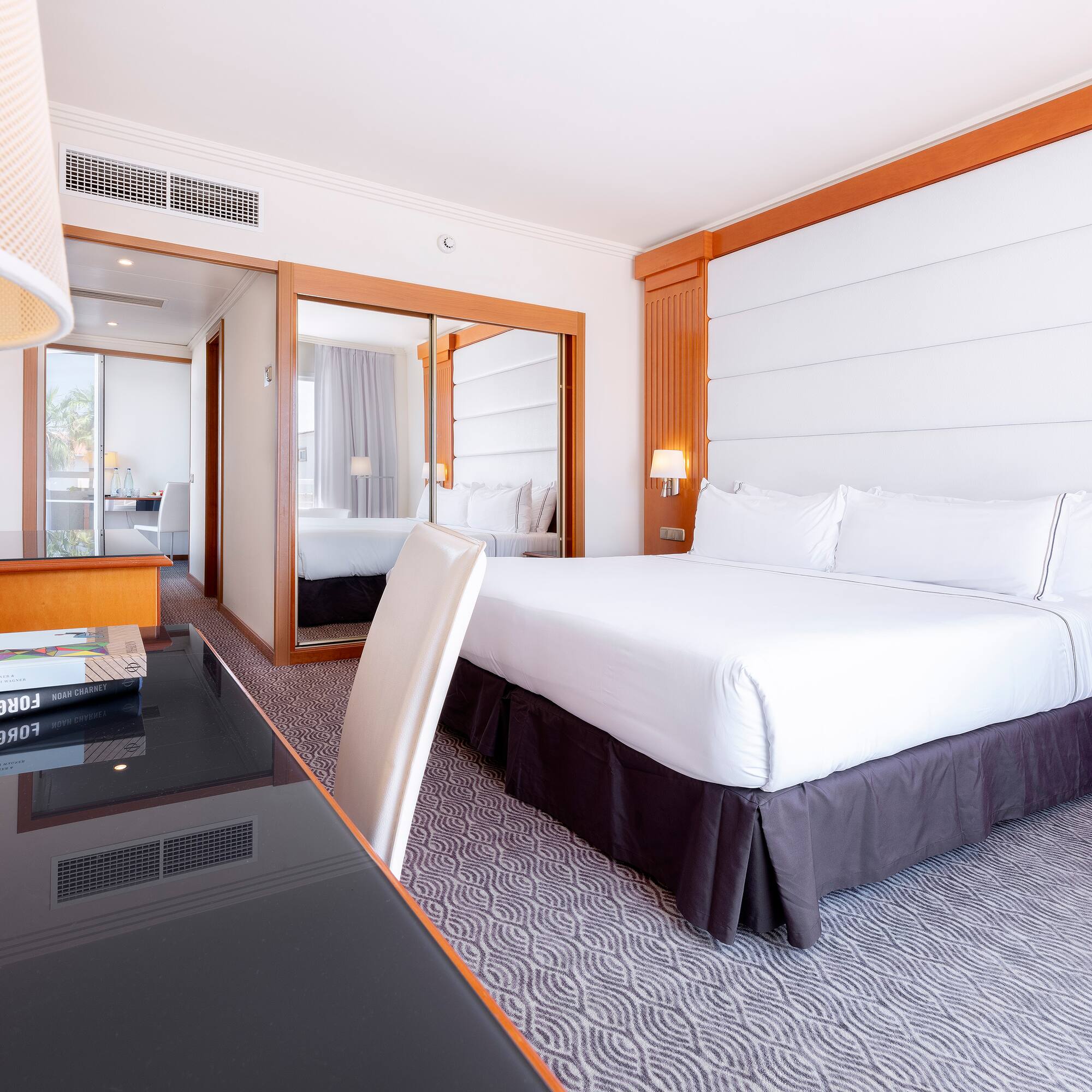 a room with a bed and a desk