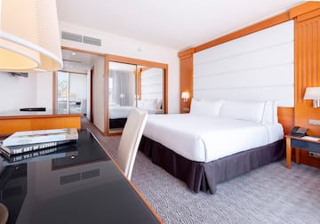 a room with a bed and a desk