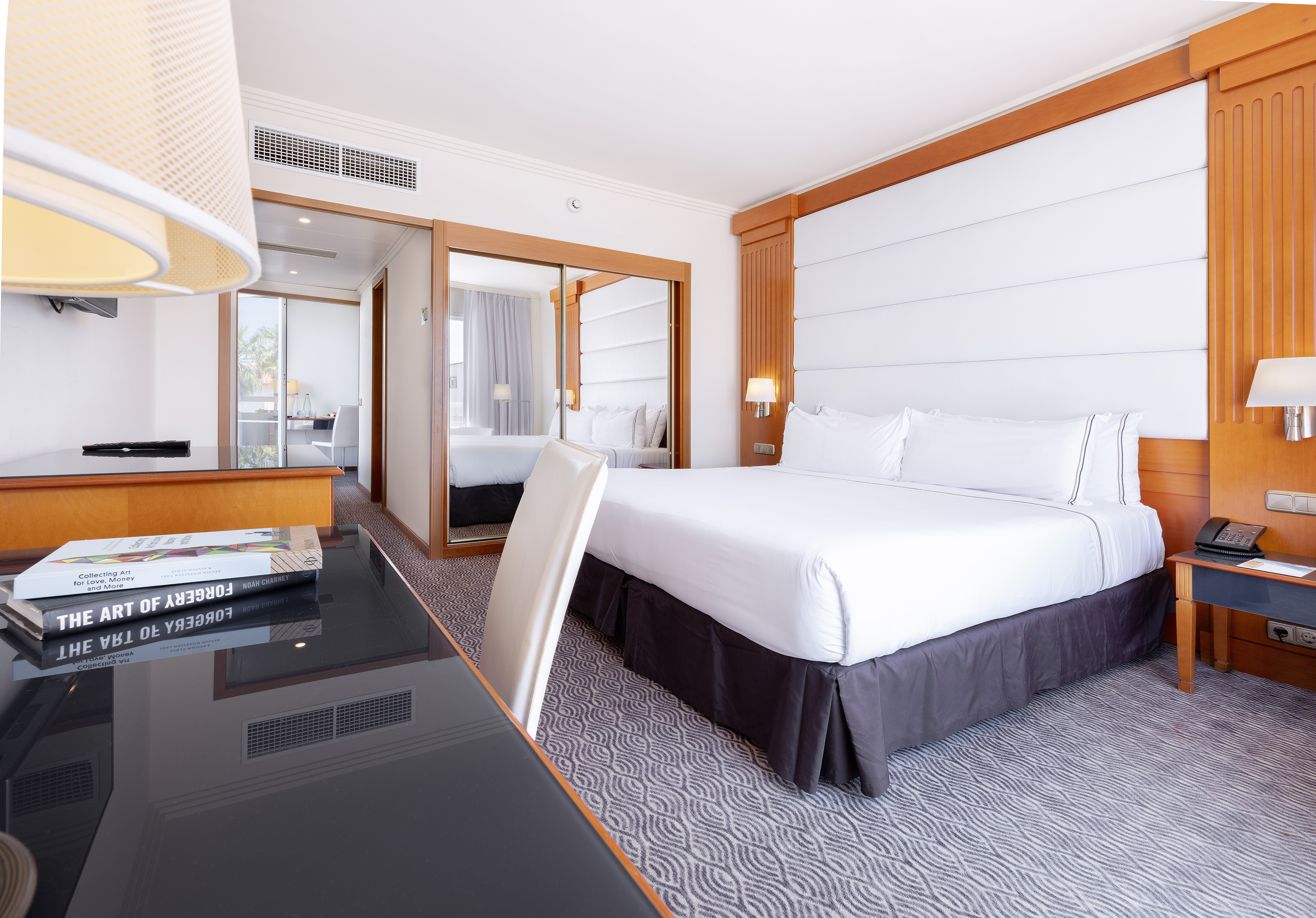 a room with a bed and a desk