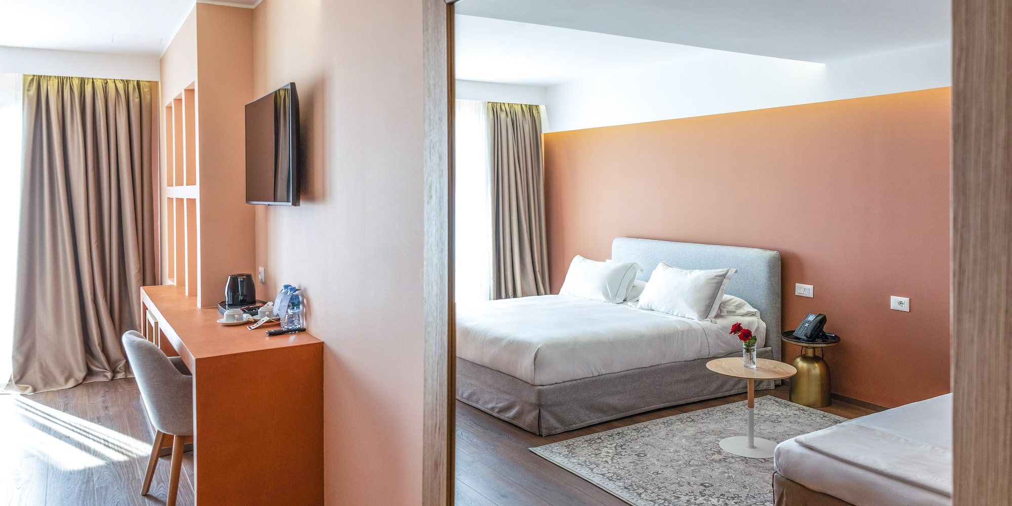 a room with a bed and a desk