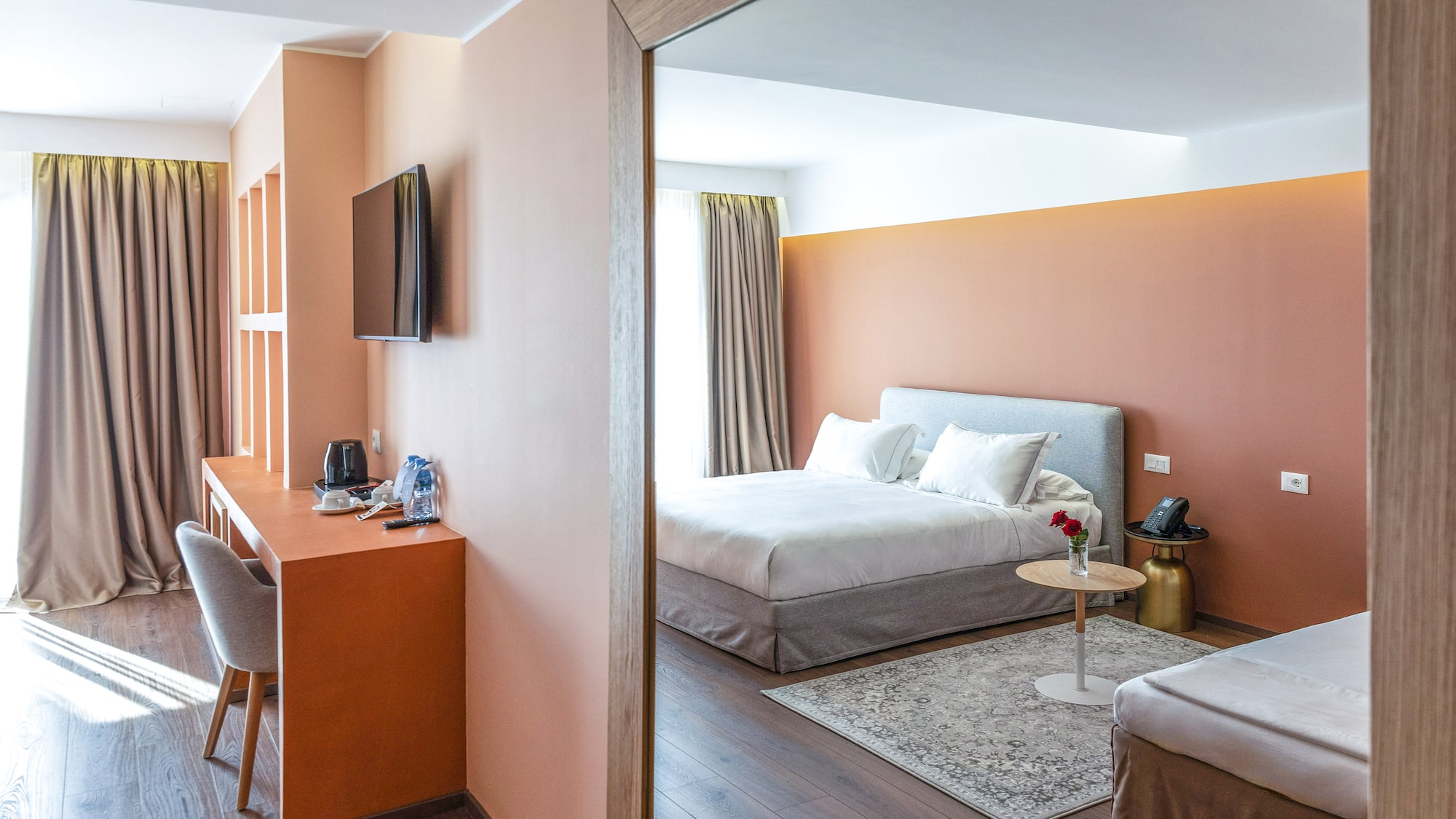 a room with a bed and a desk