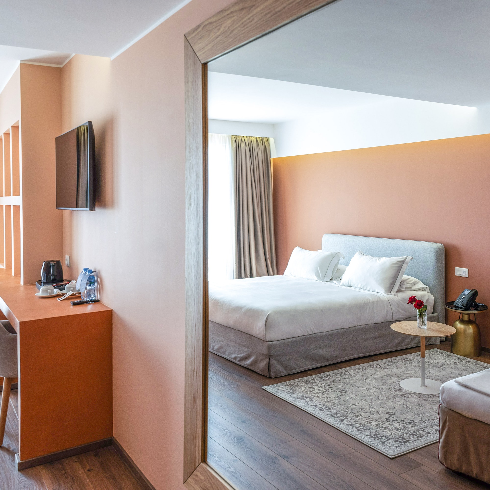 a room with a bed and a desk