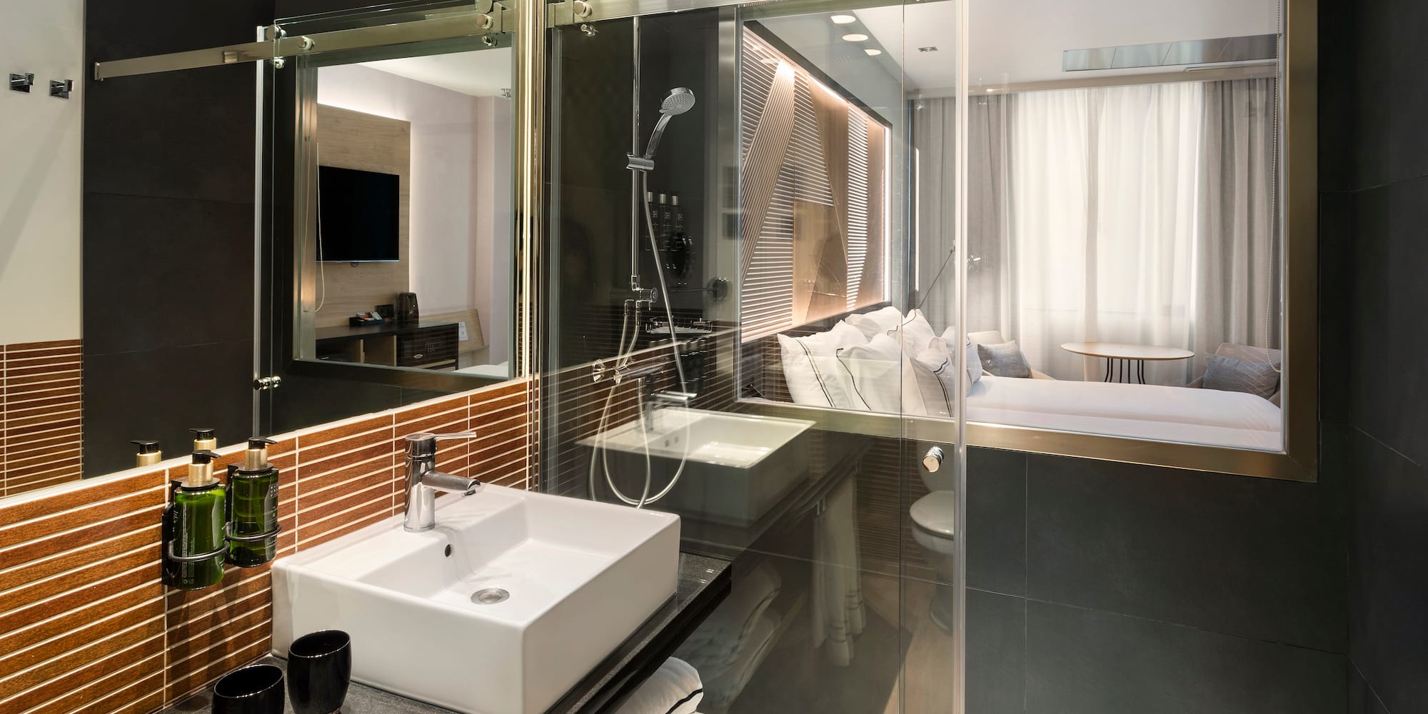a bathroom with a glass shower door