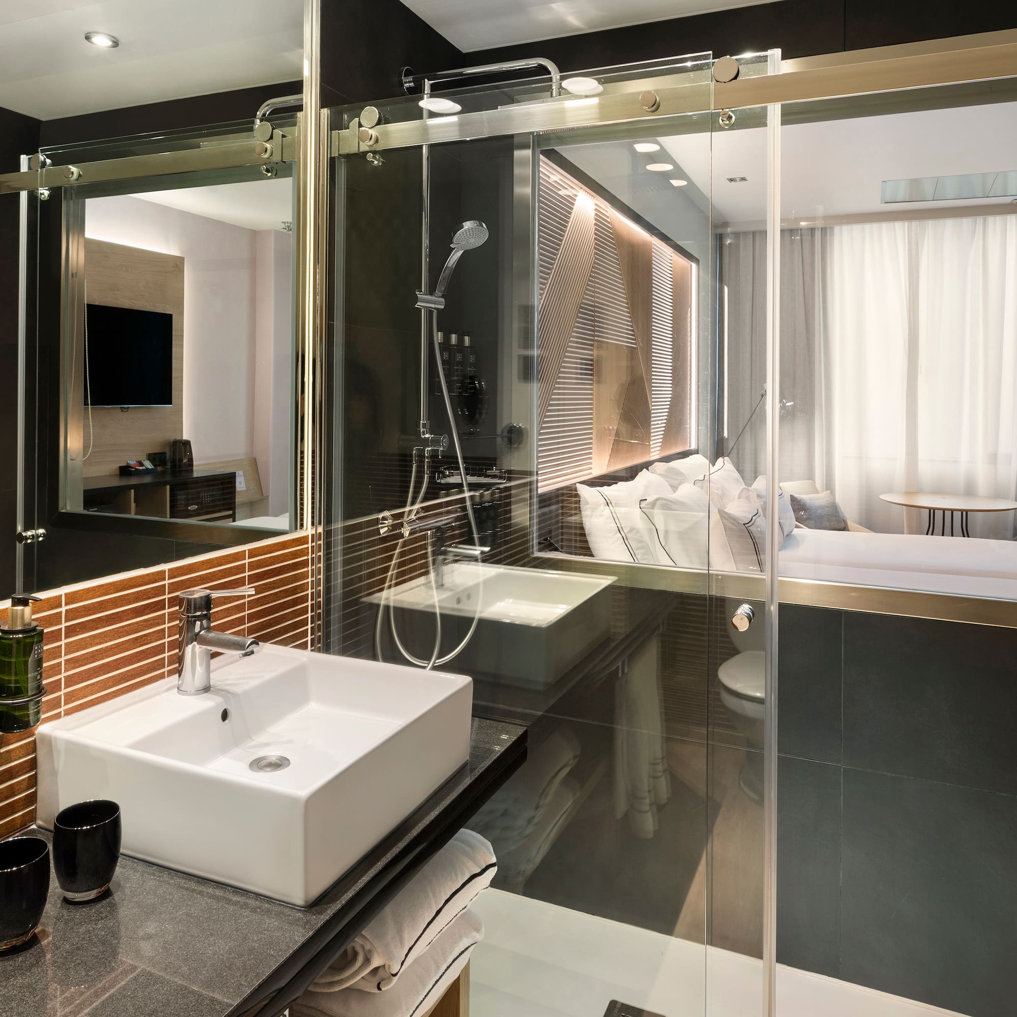 a bathroom with a glass shower door