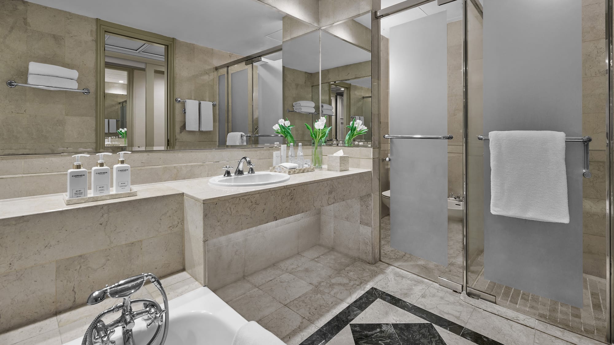 a bathroom with a shower and sink