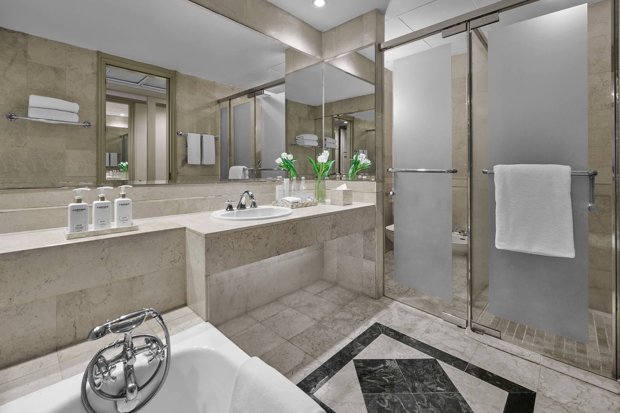 a bathroom with a shower and sink