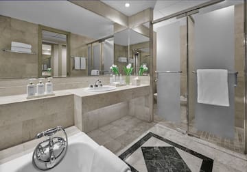 a bathroom with a shower and sink