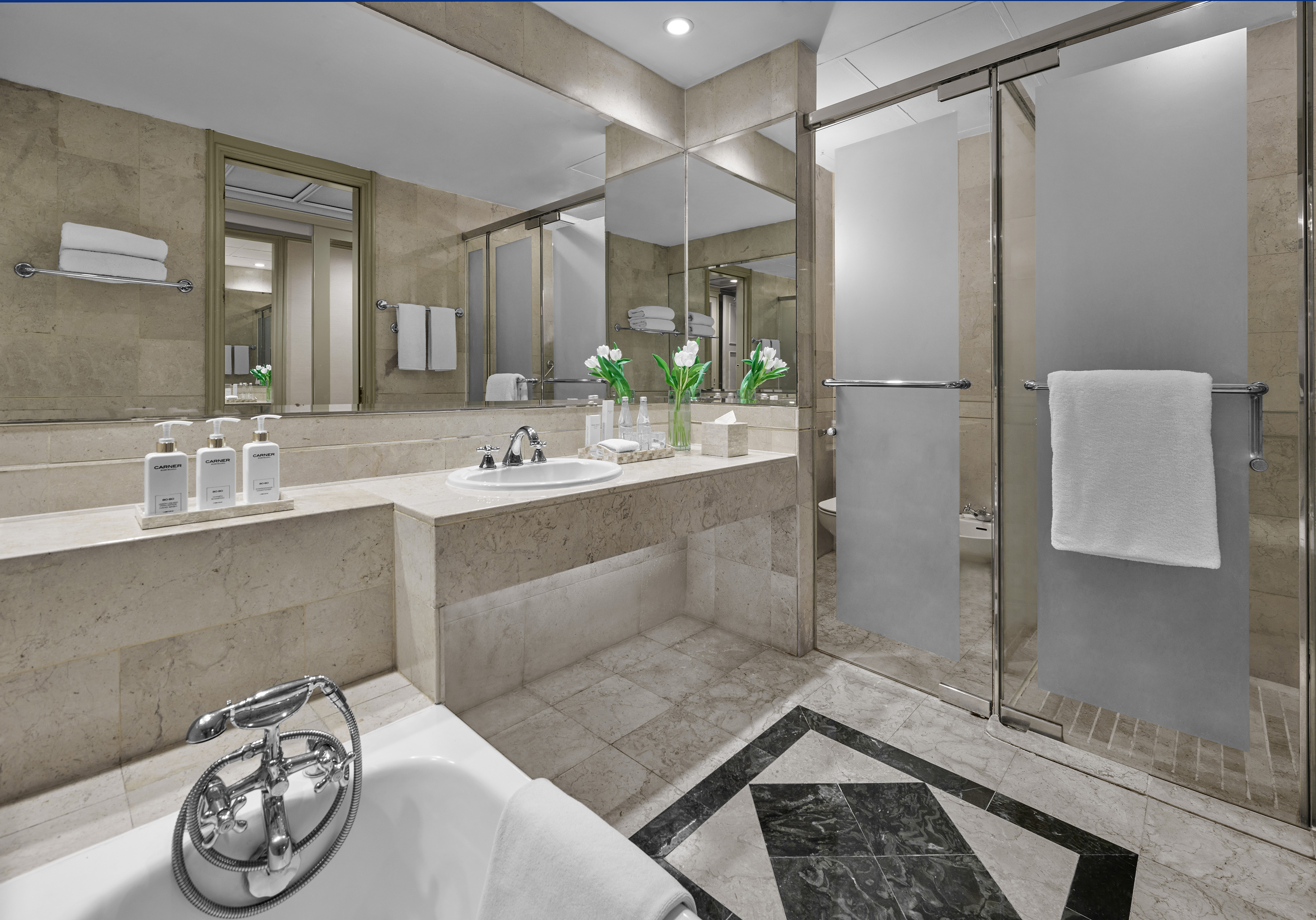 a bathroom with a shower and sink