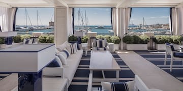 a room with a view of boats and water