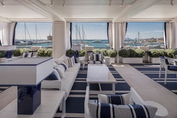 a room with a view of boats and water